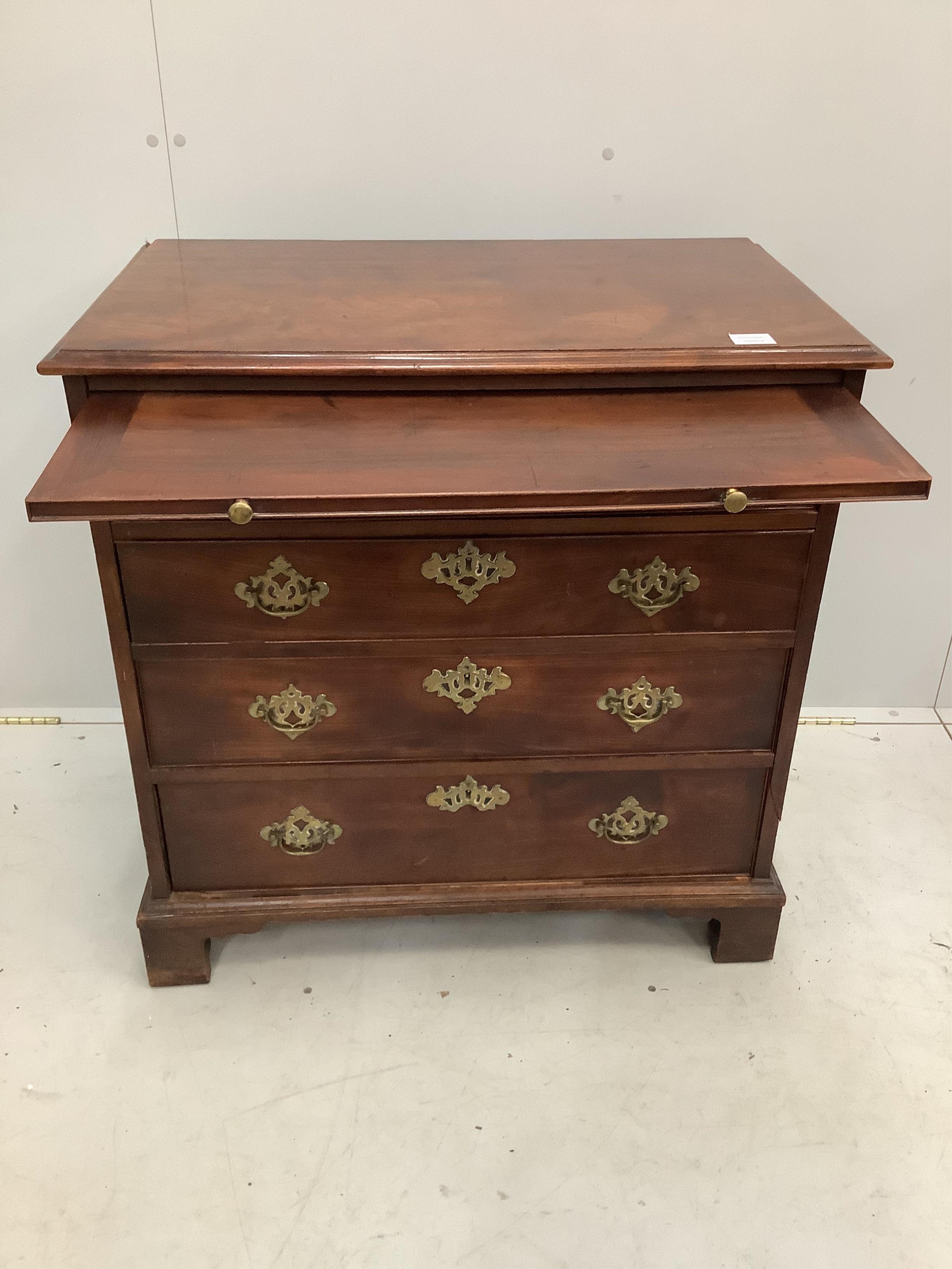 A small George III mahogany chest, fitted four long drawers, beneath a brushing slide, width 80cm, depth 49cm, height 81cm. Condition - fair